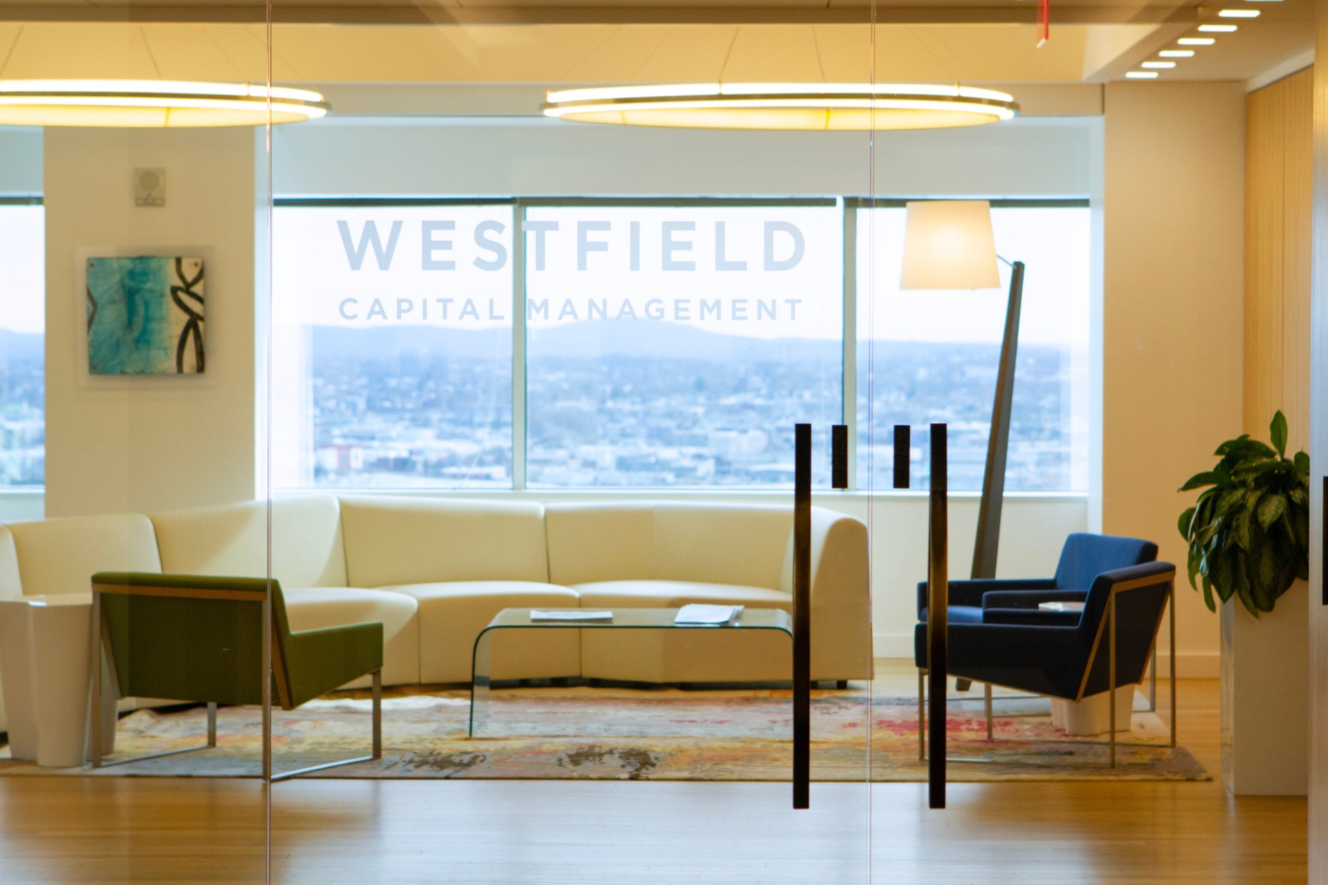 A team built on experience and insight. Westfield office through the entry door frosted glass