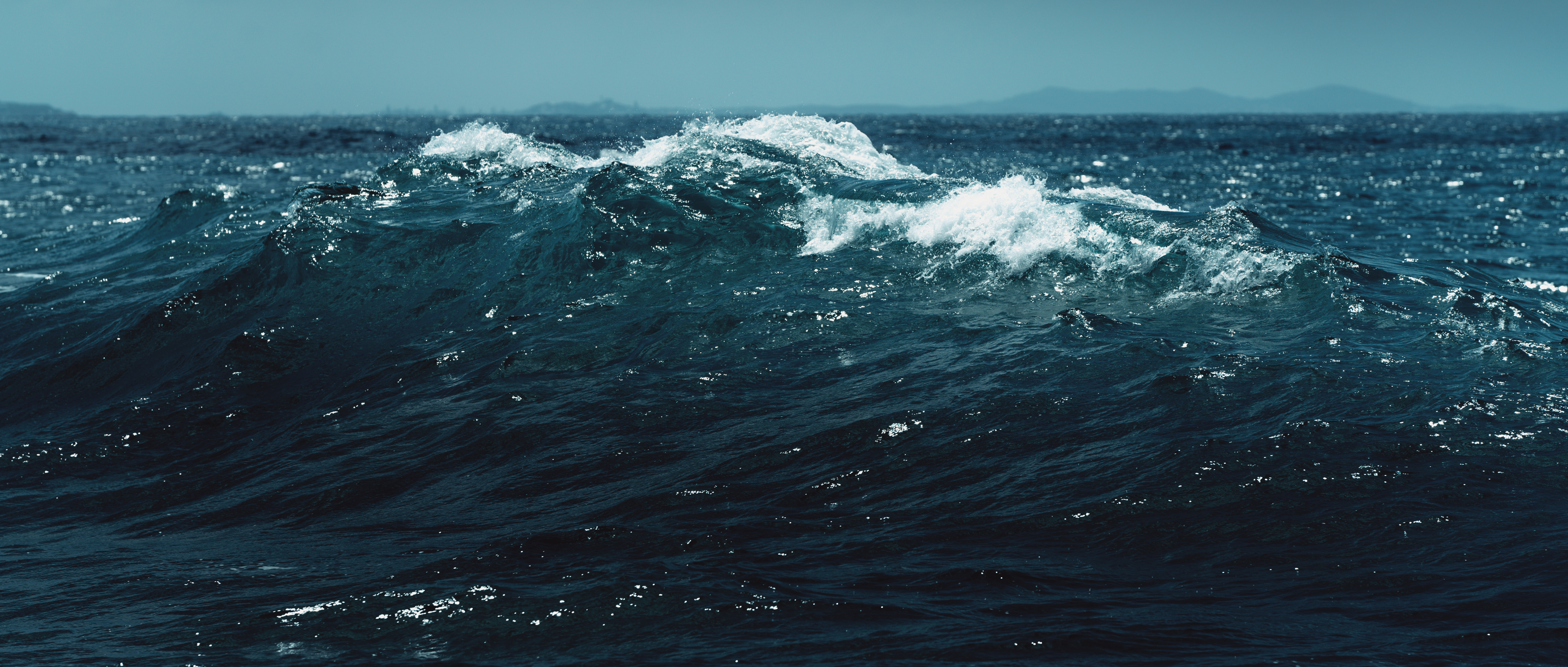 Peak Uncertainty. White capping ocean waves.