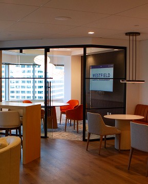 Contact Us. Let’s connect. Westfield Capital's employee lounge in the office, designed with contemporary and modern finishes.